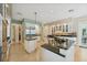 Open concept kitchen features dual islands, granite countertops, and ample storage space at 4224 Boca Pointe Dr, Sarasota, FL 34238
