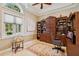 Inviting office with large window, custom wood built-ins, and a comfortable workspace at 4224 Boca Pointe Dr, Sarasota, FL 34238