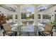 Screened-in patio featuring a glass table and chairs, overlooking the pool and landscaped backyard at 4224 Boca Pointe Dr, Sarasota, FL 34238