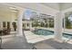 Spacious screened-in pool area with stylish patio furniture and scenic views at 4224 Boca Pointe Dr, Sarasota, FL 34238