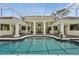 Beautiful pool and spa area with decorative statues and manicured landscaping at 4224 Boca Pointe Dr, Sarasota, FL 34238