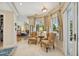 Bright sitting room features plush chairs, natural light, and views of the beautifully landscaped exterior at 4224 Boca Pointe Dr, Sarasota, FL 34238