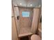 Modern bathroom with a tiled shower, glass enclosure, and sleek fixtures at 4460 Emerald Ridge Dr, Sarasota, FL 34233