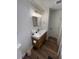 The bathroom features modern lighting, vanity and sink with ample storage at 4460 Emerald Ridge Dr, Sarasota, FL 34233