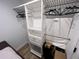 Well organized walk-in closet features custom shelving and hanging space for optimal storage solutions at 4460 Emerald Ridge Dr, Sarasota, FL 34233