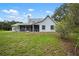 A beautiful backyard with a screened in porch, perfect for relaxation and entertaining at 4513 Hidden River Rd, Sarasota, FL 34240