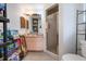 Cozy bathroom with walk in shower, nice mirror and vanity, and storage racks at 4513 Hidden River Rd, Sarasota, FL 34240