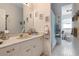 Bathroom featuring vanity, tile floors, and decorative touches at 4513 Hidden River Rd, Sarasota, FL 34240