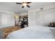 Bright bedroom featuring a large window, hardwood floors, and modern finishes at 4513 Hidden River Rd, Sarasota, FL 34240