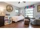 Cozy bedroom featuring hardwood floors, a bed, and neutral walls at 4513 Hidden River Rd, Sarasota, FL 34240