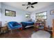 This bedroom features a bed, chair, a closet and windows at 4513 Hidden River Rd, Sarasota, FL 34240