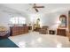 Bright and airy bedroom features neutral walls, tile flooring, and ample space for relaxation and rest at 4513 Hidden River Rd, Sarasota, FL 34240