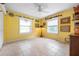 Bright bedroom with two large windows, neutral tile floors, and ample light at 4513 Hidden River Rd, Sarasota, FL 34240