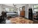 Bright bedroom featuring a large window, hardwood floors, and modern finishes at 4513 Hidden River Rd, Sarasota, FL 34240