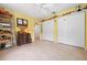 Spacious bedroom featuring tile floors, ceiling fan, and closet space, providing ample storage at 4513 Hidden River Rd, Sarasota, FL 34240