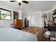Bright bedroom featuring a large window, hardwood floors, and modern finishes at 4513 Hidden River Rd, Sarasota, FL 34240
