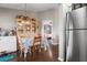 Light-filled dining space with natural wood accents and a view to the bedroom at 4513 Hidden River Rd, Sarasota, FL 34240