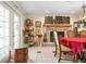 Dining room with fireplace, chandelier, and access to outdoor space, blending indoor-outdoor living at 4513 Hidden River Rd, Sarasota, FL 34240