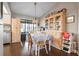 Bright dining area with hutch, wood floors, and a window view offers a pleasant dining experience at 4513 Hidden River Rd, Sarasota, FL 34240
