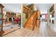 Inviting entryway features wood stairs and tile flooring, complemented by decor and a glimpse into the dining area at 4513 Hidden River Rd, Sarasota, FL 34240