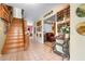 Inviting foyer with staircase, decorative furnishings, and tiled flooring at 4513 Hidden River Rd, Sarasota, FL 34240