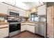 Well-equipped kitchen with stainless steel appliances and plenty of counter space at 4513 Hidden River Rd, Sarasota, FL 34240