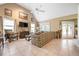 Spacious living room boasts vaulted ceilings, neutral tones, tile floors, and abundant natural light at 4513 Hidden River Rd, Sarasota, FL 34240
