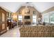 Inviting living room with high ceilings, tile flooring, and abundant natural light creates a warm and airy atmosphere at 4513 Hidden River Rd, Sarasota, FL 34240