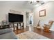 Comfortable living room with a large TV, area rug, and a calming color scheme creates a welcoming space at 4513 Hidden River Rd, Sarasota, FL 34240