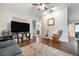 Cozy living room with wood floors, ceiling fan, and neutral color palette provides a relaxing atmosphere at 4513 Hidden River Rd, Sarasota, FL 34240