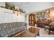 Spacious living room features vaulted ceilings, tile flooring, and an elegant piano, perfect for relaxation and entertaining at 4513 Hidden River Rd, Sarasota, FL 34240