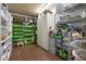 Spacious pantry with ample shelving, organized storage, and laminate wood flooring at 4513 Hidden River Rd, Sarasota, FL 34240