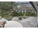 Private pool with screened enclosure and stone tile deck at 4513 Hidden River Rd, Sarasota, FL 34240