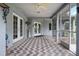 Spacious screened in lanai showcases brick pattern floors and multiple access points at 4513 Hidden River Rd, Sarasota, FL 34240