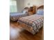 Bright bedroom with two twin beds and wood floors at 4520 47Th W Ave # 103, Bradenton, FL 34210
