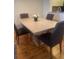 Dining room area with four chairs and wood flooring at 4520 47Th W Ave # 103, Bradenton, FL 34210