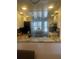 Bright, renovated kitchen area adjacent to dining room at 4520 47Th W Ave # 103, Bradenton, FL 34210