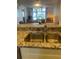 An open-concept kitchen provides seamless flow into the living room at 4520 47Th W Ave # 103, Bradenton, FL 34210
