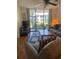 Living room with sliding glass door and hardwood flooring at 4520 47Th W Ave # 103, Bradenton, FL 34210