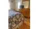 The main bedroom offers a king-sized bed and dresser at 4520 47Th W Ave # 103, Bradenton, FL 34210