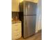 This stainless steel refrigerator nicely complements the kitchen's design and color palette at 4520 47Th W Ave # 103, Bradenton, FL 34210