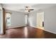 Spacious bedroom featuring a ceiling fan, wood flooring, and natural light at 4565 Eldron Ave, North Port, FL 34286