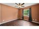 Bedroom with hardwood floors, a ceiling fan, and an exterior view at 4565 Eldron Ave, North Port, FL 34286