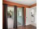 Bedroom showcasing a sliding glass door leading to lanai and a view into the kitchen at 4565 Eldron Ave, North Port, FL 34286