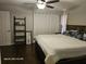 Comfortable bedroom featuring wood floors, a ceiling fan, and a cozy bed at 4565 Eldron Ave, North Port, FL 34286