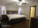 Cozy bedroom featuring a comfortable bed and dark wood floors at 4565 Eldron Ave, North Port, FL 34286