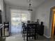 Dining area featuring a table with seating for six, and natural light at 4565 Eldron Ave, North Port, FL 34286