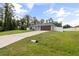 Beautiful home with a spacious yard and long driveway leading to the attached garage at 4565 Eldron Ave, North Port, FL 34286