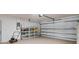 Spacious garage with shelving and ample storage space for vehicles and equipment at 4565 Eldron Ave, North Port, FL 34286