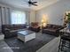 Bright living room with comfortable seating, a large coffee table and natural light at 4565 Eldron Ave, North Port, FL 34286
